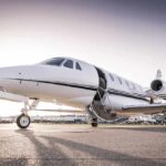 Washington Divert: Engine Blows On DHS Flight Private jet on airport tarmac with open door at sunset