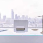 law office desk with laptop book and scales of justice