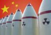 Hypersonic Menace Shrinks U.S. Reaction Time Row of nuclear missiles with radiation symbols before a red flag with yellow stars