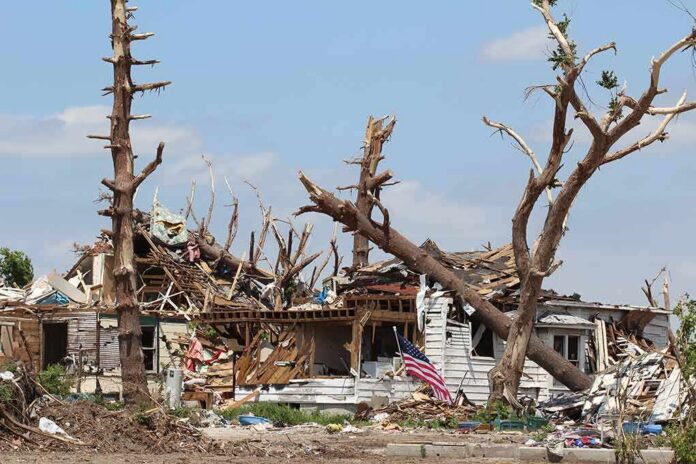 shutterstock_81036685 Storm-damaged house with fallen trees and debris