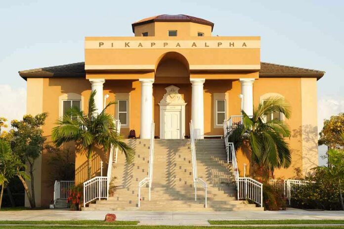 shutterstock_10719022 Fraternity house with columns and palm trees in front