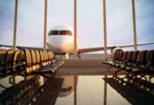 Bleeding Pilot Makes One Last Push to Save Jet Airplane seen through terminal windows with empty gate seating