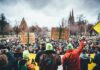 Paris Schools Gridlocked – Students Rebel Christian Jones at a large outdoor protest with crowds and handmade signs