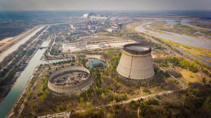 Abandoned cooling towers at a sprawling industrial site