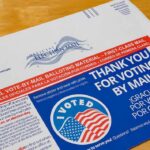 Mail-in ballot envelope with thank you message and I Voted sticker