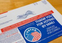 Mail-in ballot envelope with thank you message and I Voted sticker