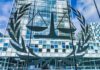 License Plate Tracking Gets Torched Scales of justice emblem on glass facade of modern office building