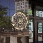 Harvard Hiring Files Under Federal Siege FBI seal on a building entrance