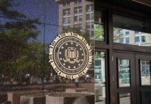 Harvard Hiring Files Under Federal Siege FBI seal on a building entrance