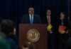 Acquitted Pastor Now Guilty – Same Facts Man at podium during press conference with officials behind him