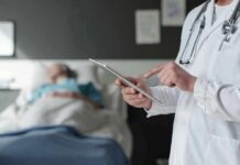 Dentist Visit Uncovers Deadly Time Bomb Doctor using tablet beside hospital patient