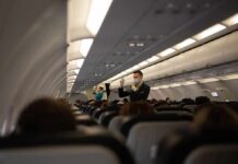 FBI Flags In-Flight Assault – Blair Detained Flight attendant demonstrates safety procedures in airplane cabin