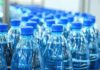 Reservoir Collapse Sparks Wild Island Rules Plastic water bottles with blue caps in rows