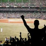 Foul Ball Brawl: Law Beats Loud Chants Crowd of fans cheering at a baseball game in a stadium